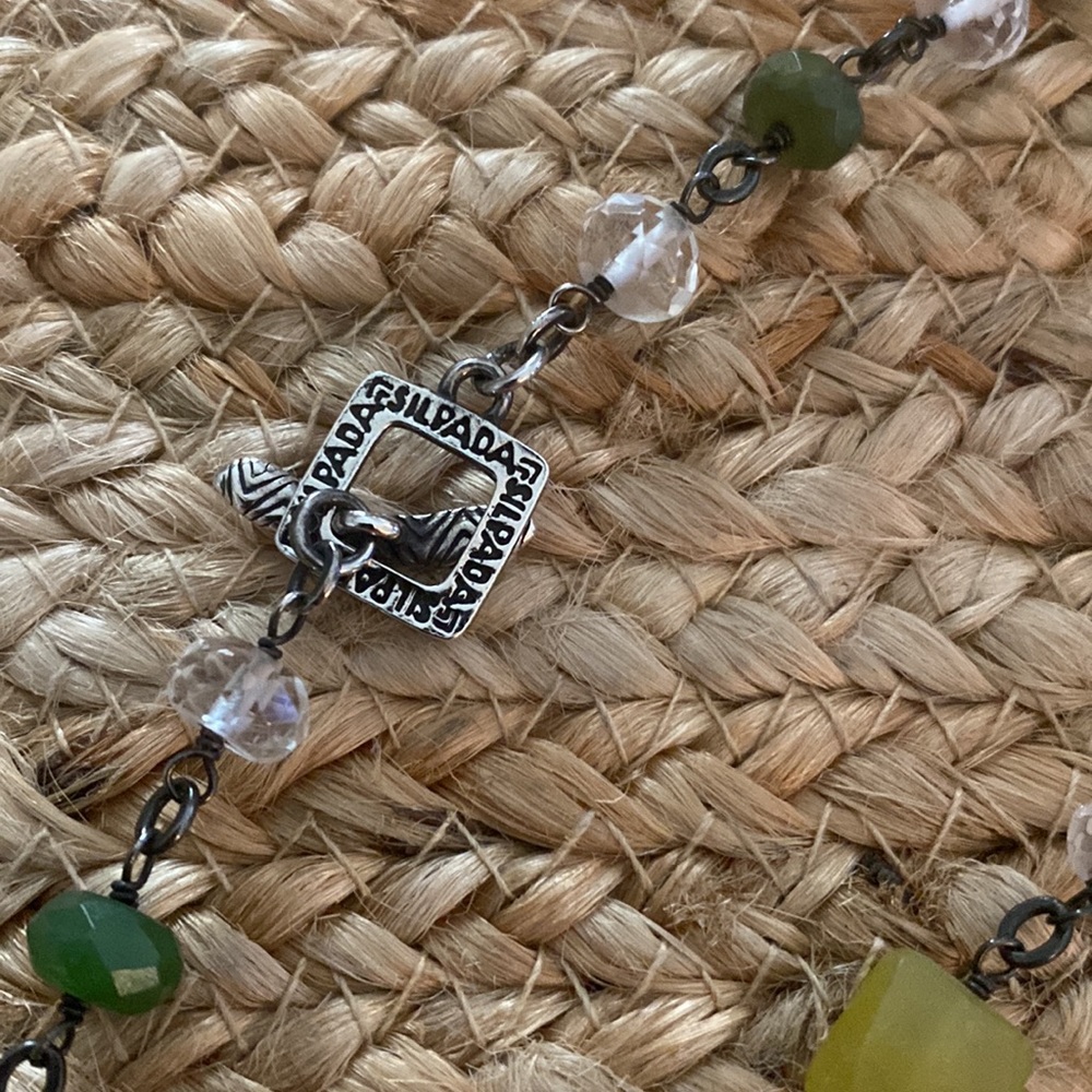 Silpada Long gated necklace,beautiful different shades of green gemstones.